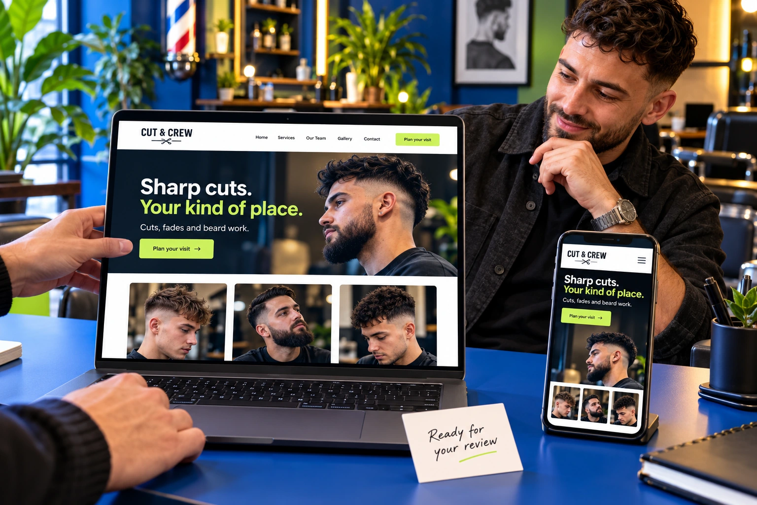 Illustrative barber reviewing his finished website on a laptop and phone with a designer
